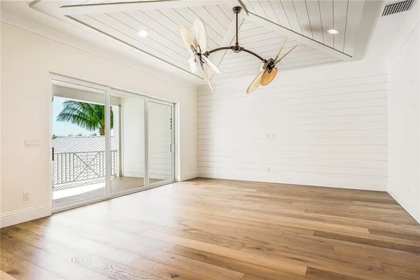 a view of a livingroom with wooden floor and a window
