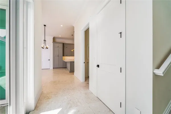 a view of a hallway with a room