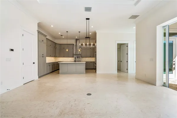 a view of a kitchen with a sink and cabinets