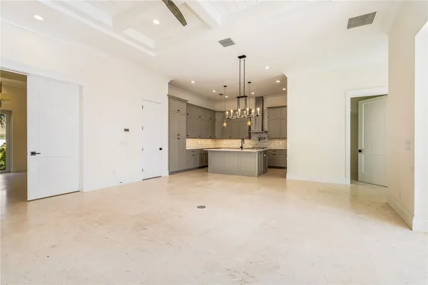 a view of a kitchen with a sink and a window