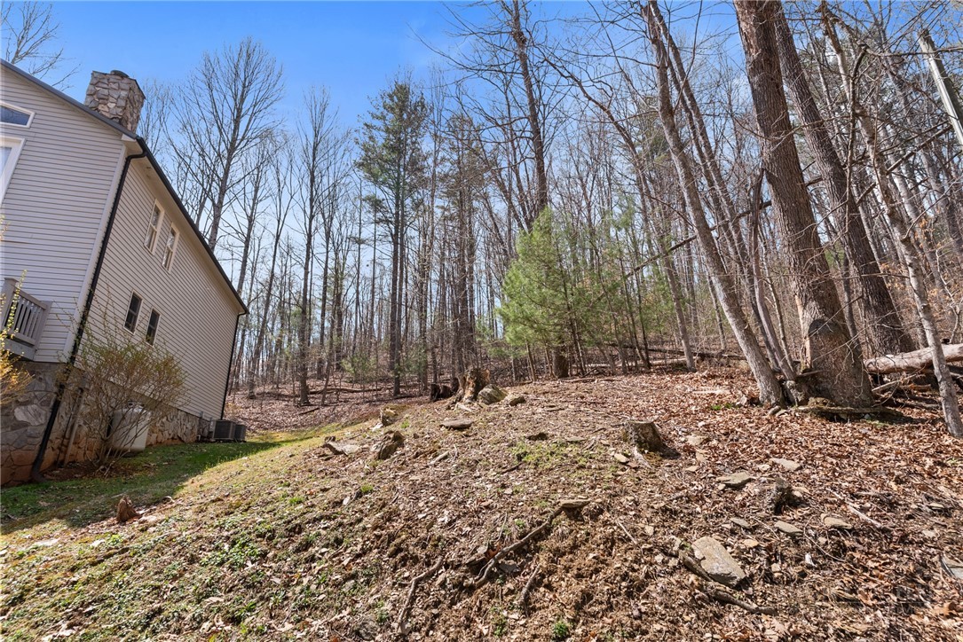 271 Quail Hollow Road Crumpler, NC 28617 - Photo 3 of 30 a backyard of a house with lots of green space