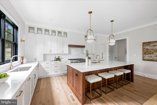 a balcony with furniture and wooden floor