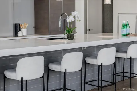 a kitchen with stainless steel appliances a sink stove and refrigerator
