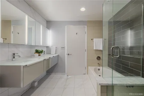 a bathroom with a sink and mirror
