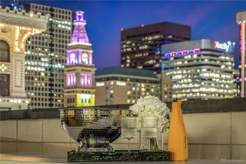 a living room with furniture a rug and a fireplace