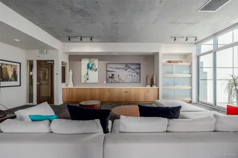 a view of a balcony with couches and wooden floor