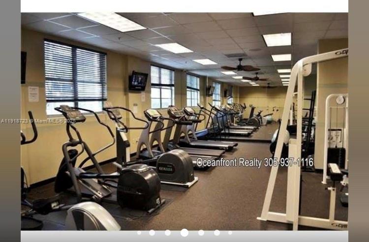 18555 Collins Avenue, Unit 4804 Sunny Isles Beach, FL 33160 - Photo 11 of 51 a view of a room with gym equipment