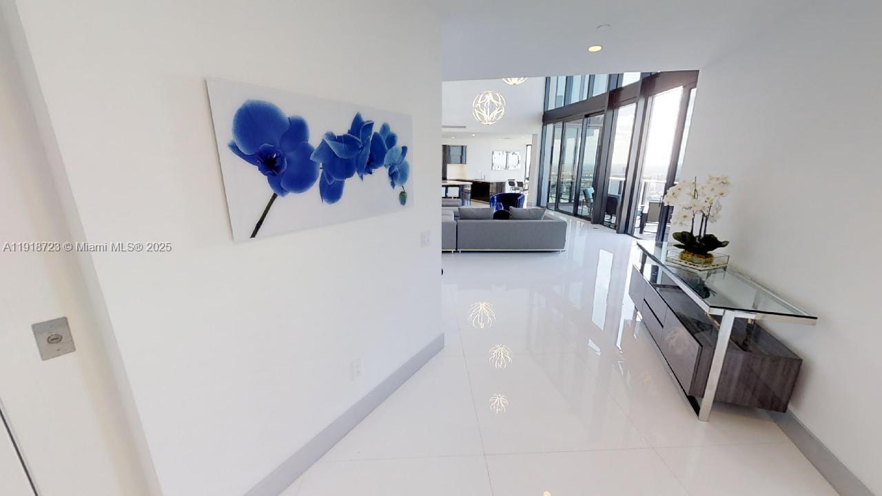 18555 Collins Avenue, Unit 4804 Sunny Isles Beach, FL 33160 - Photo 18 of 51 a view of a living room and entryway