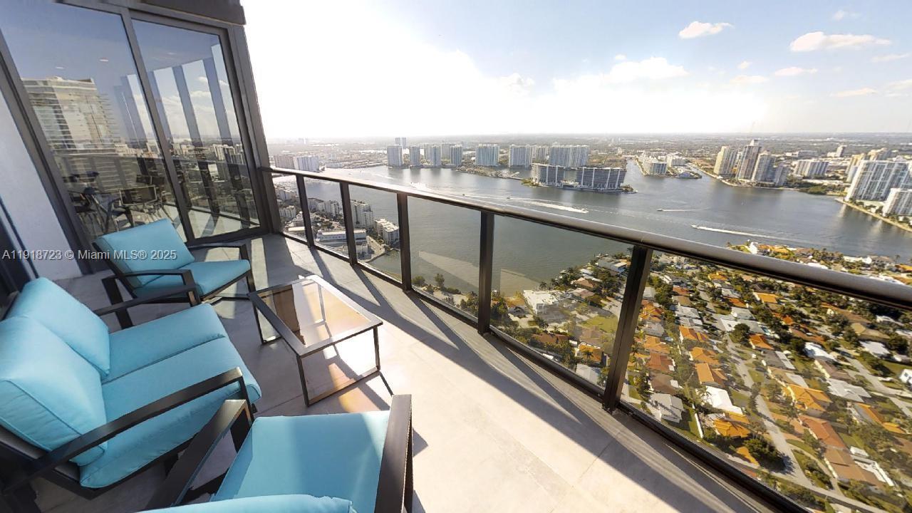 18555 Collins Avenue, Unit 4804 Sunny Isles Beach, FL 33160 - Photo 26 of 51 a view of city from a balcony