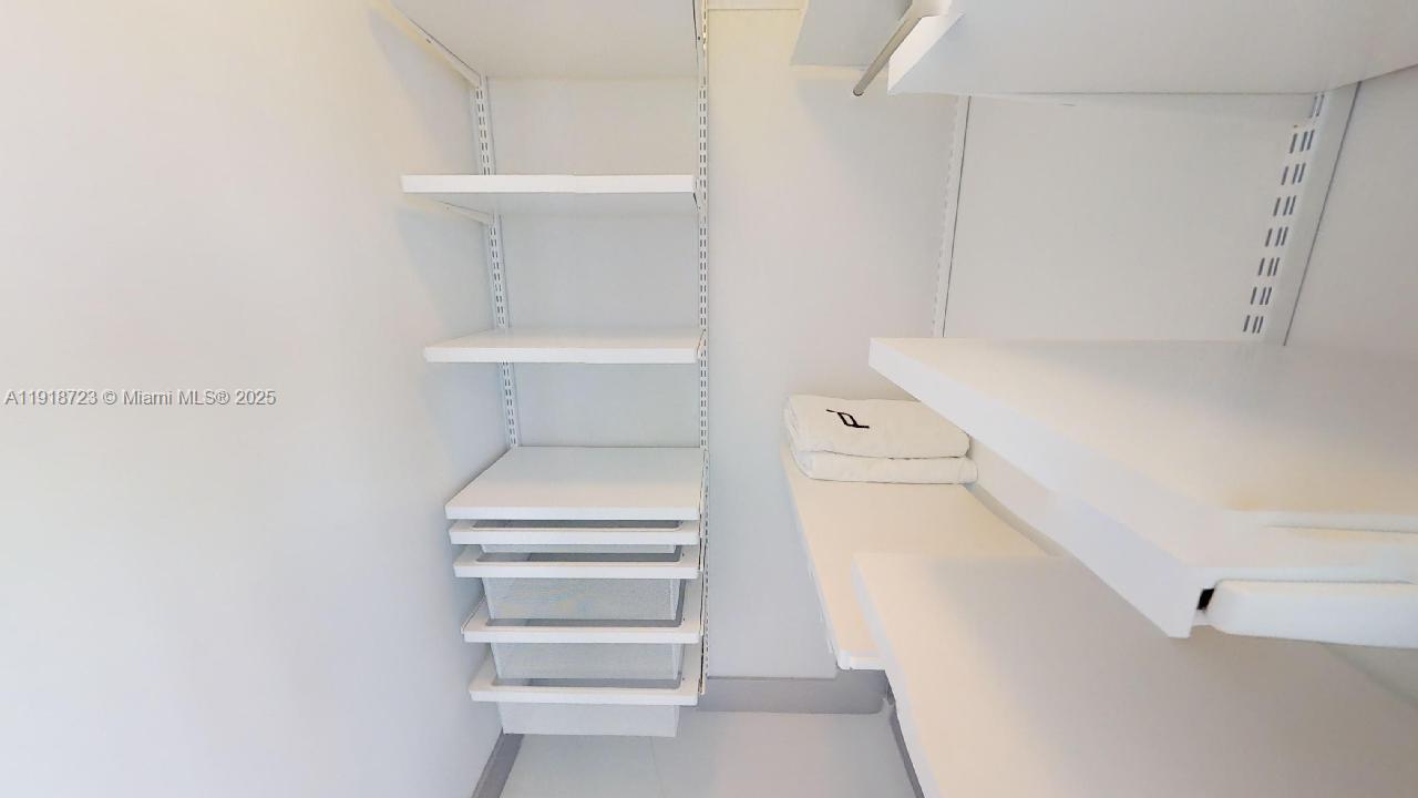 18555 Collins Avenue, Unit 4804 Sunny Isles Beach, FL 33160 - Photo 48 of 51 a bathroom with a bathtub and toilet