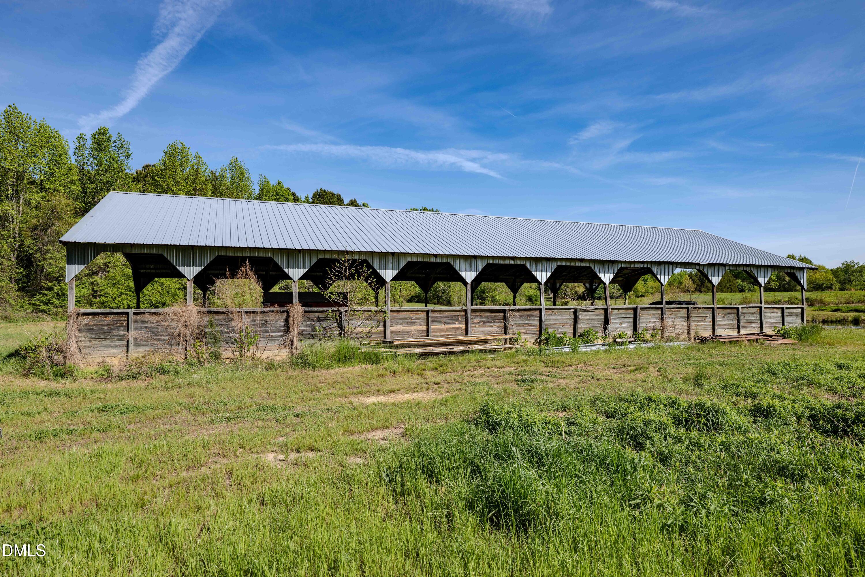 0 Bayles Road Lillington, NC 27546 - Photo 11 of 29 a view of a big yard with table and chairs under an umbrella