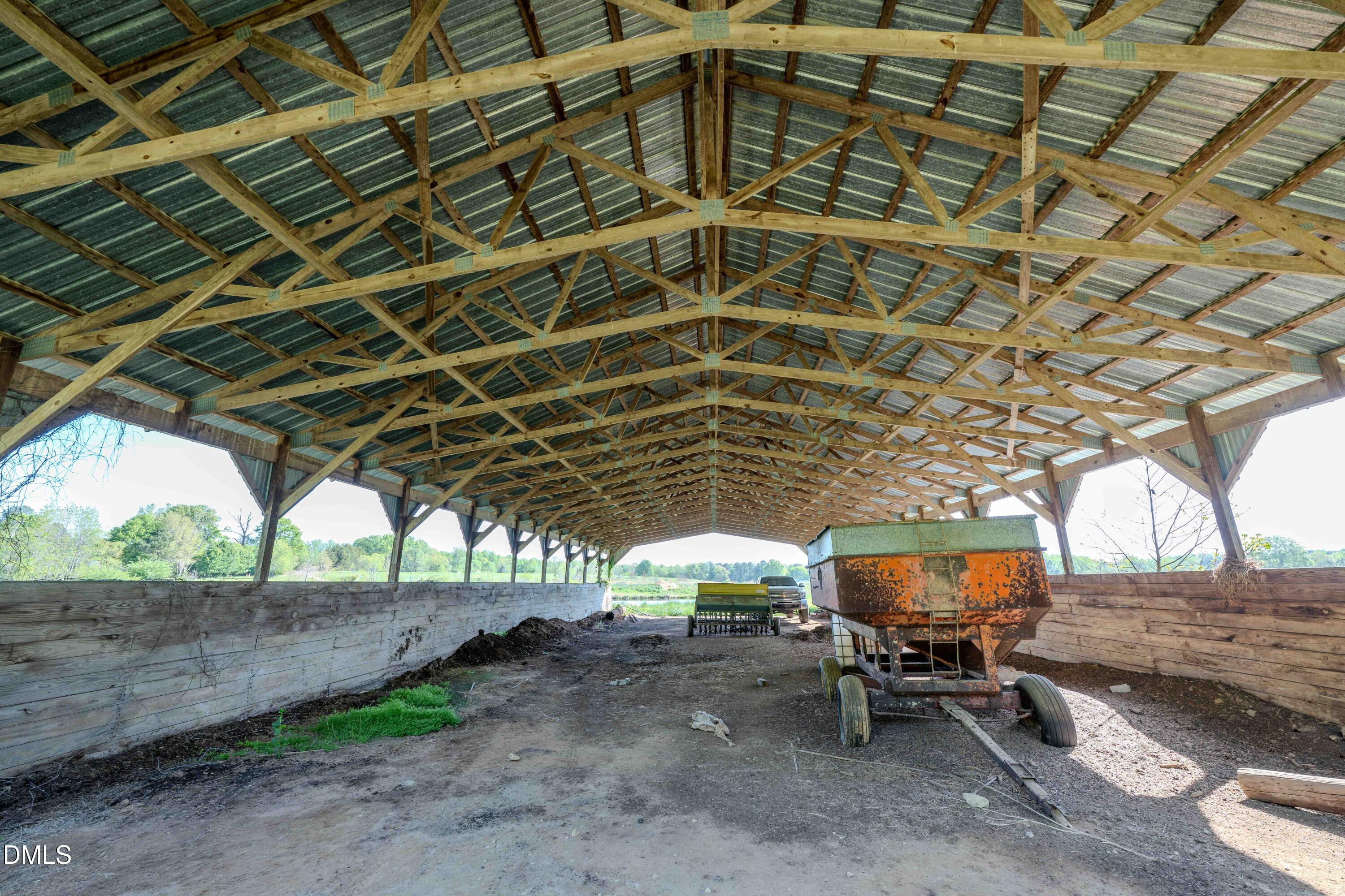 0 Bayles Road Lillington, NC 27546 - Photo 13 of 29 a view of a patio with table and chairs under an umbrella with a dry yard