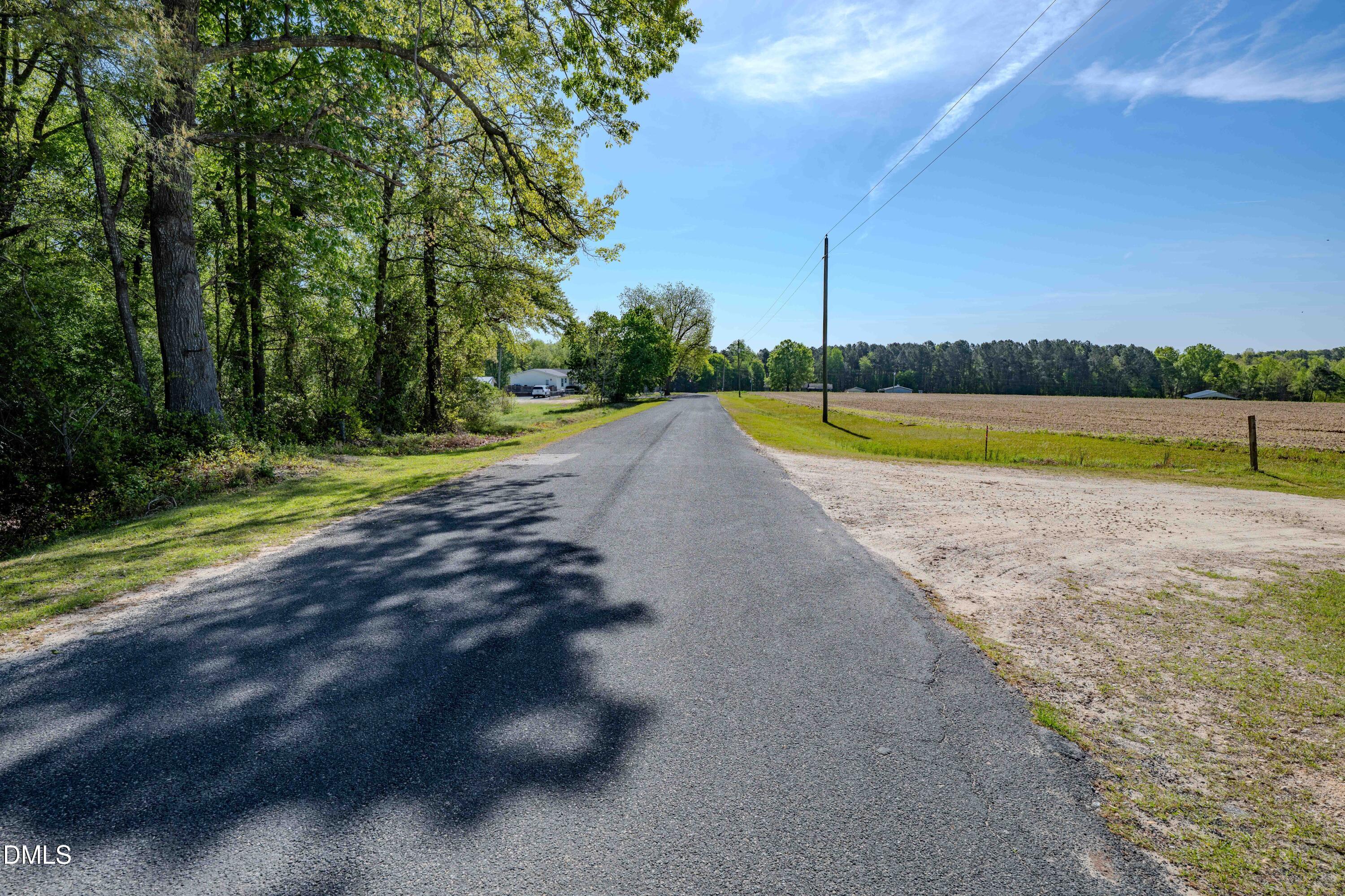 0 Bayles Road Lillington, NC 27546 - Photo 6 of 29 a view of a swimming pool with an outdoor space and seating area