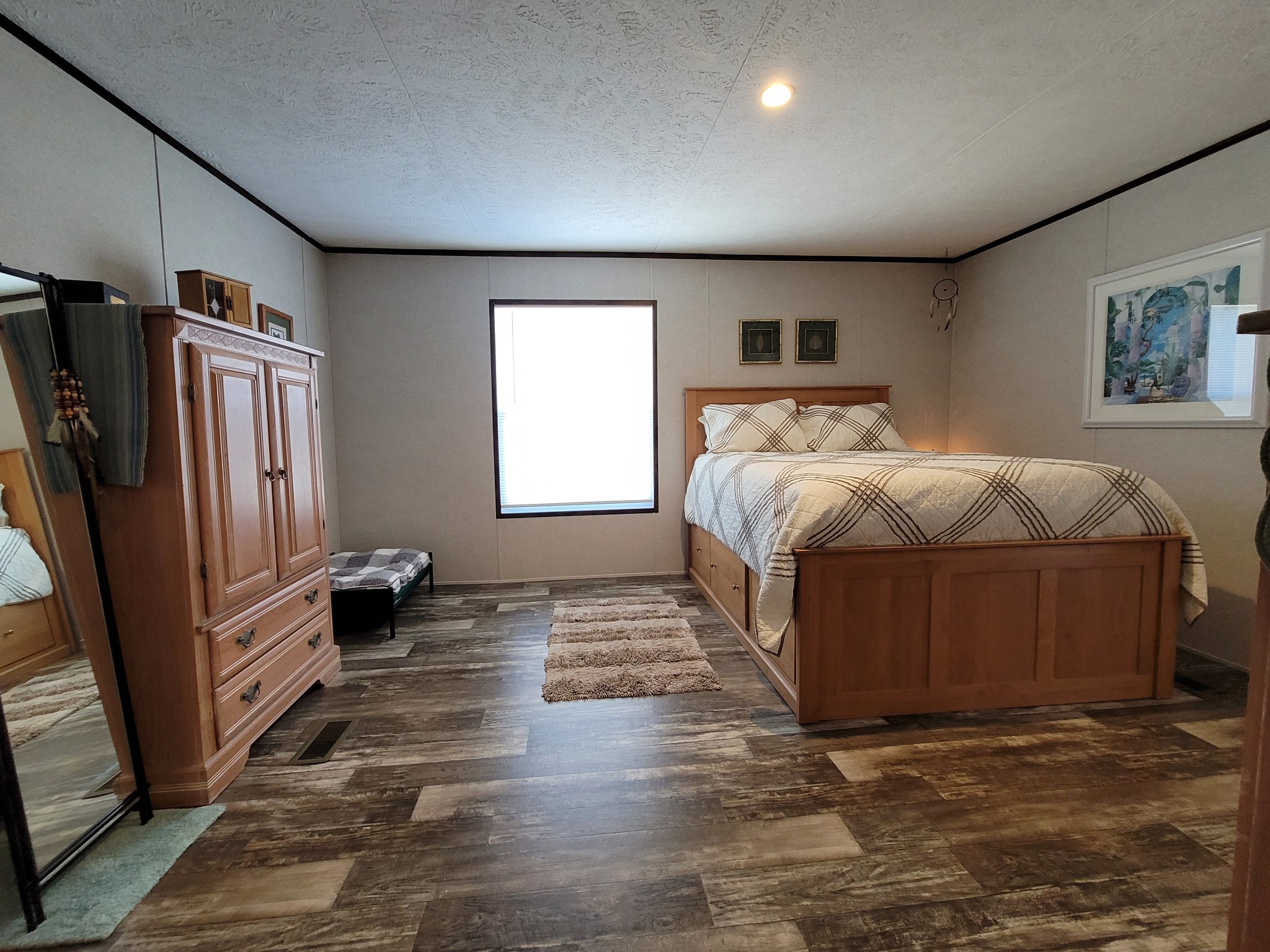 590 Jump Off Mountain Road Sewanee, TN 37375 - Photo 14 of 22 a spacious bedroom with a bed and a flat screen tv