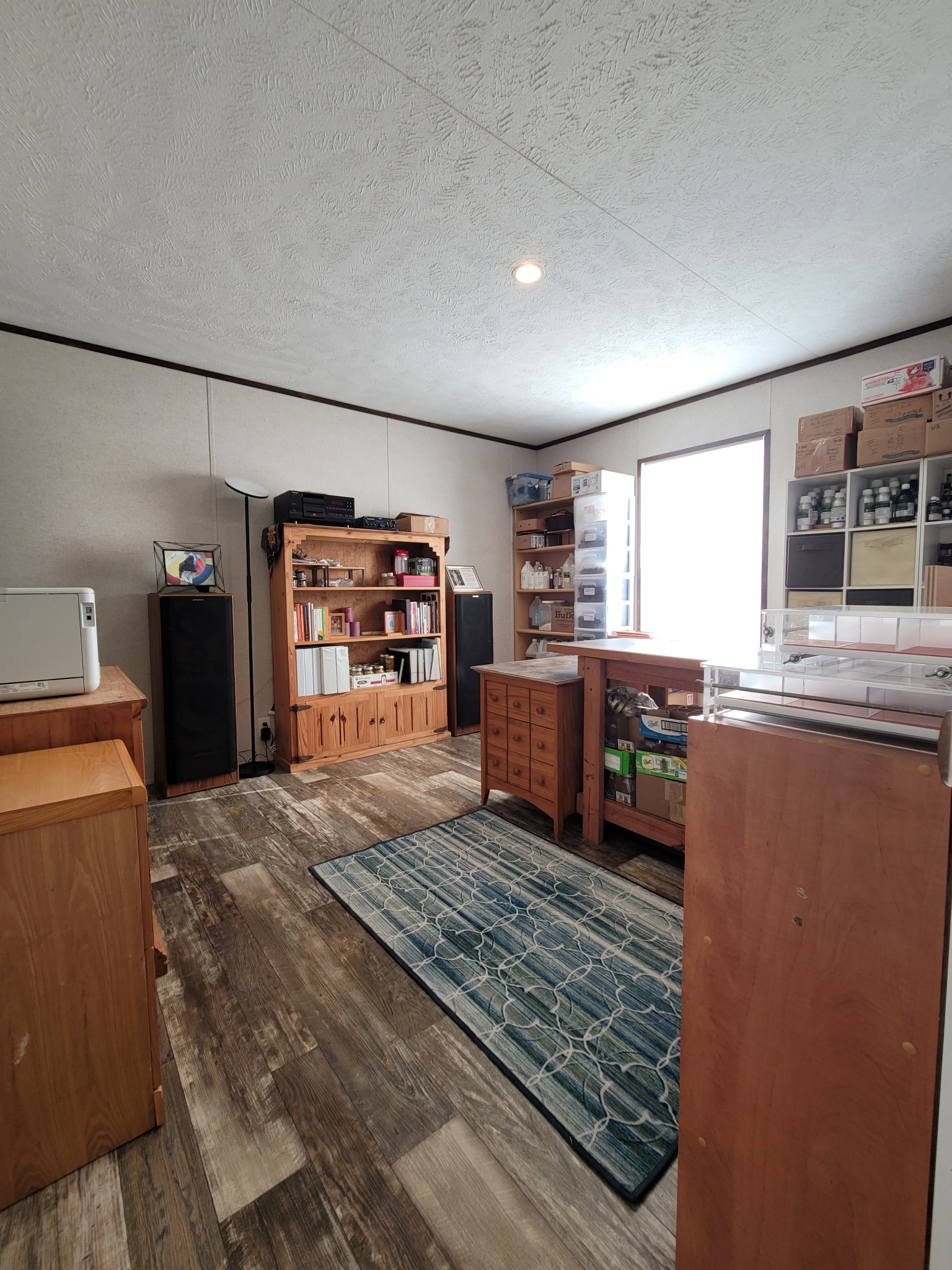 590 Jump Off Mountain Road Sewanee, TN 37375 - Photo 18 of 22 a kitchen with stainless steel appliances kitchen island granite countertop a refrigerator oven stove a large island with wooden cabinets and glass table