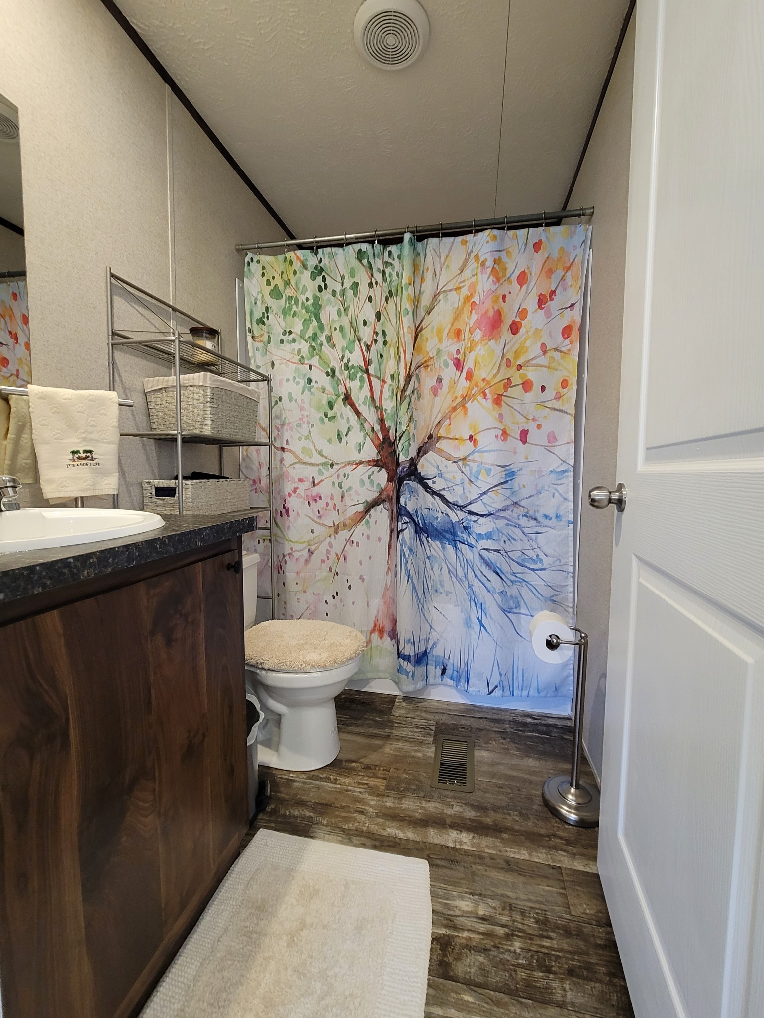 590 Jump Off Mountain Road Sewanee, TN 37375 - Photo 21 of 22 a bathroom with a toilet and a shower curtain