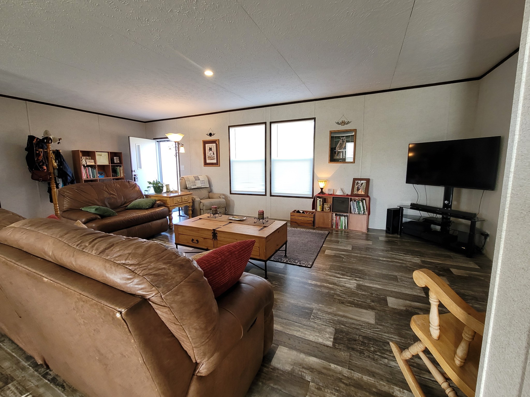 590 Jump Off Mountain Road Sewanee, TN 37375 - Photo 7 of 22 a living room with furniture a flat screen tv and a large window