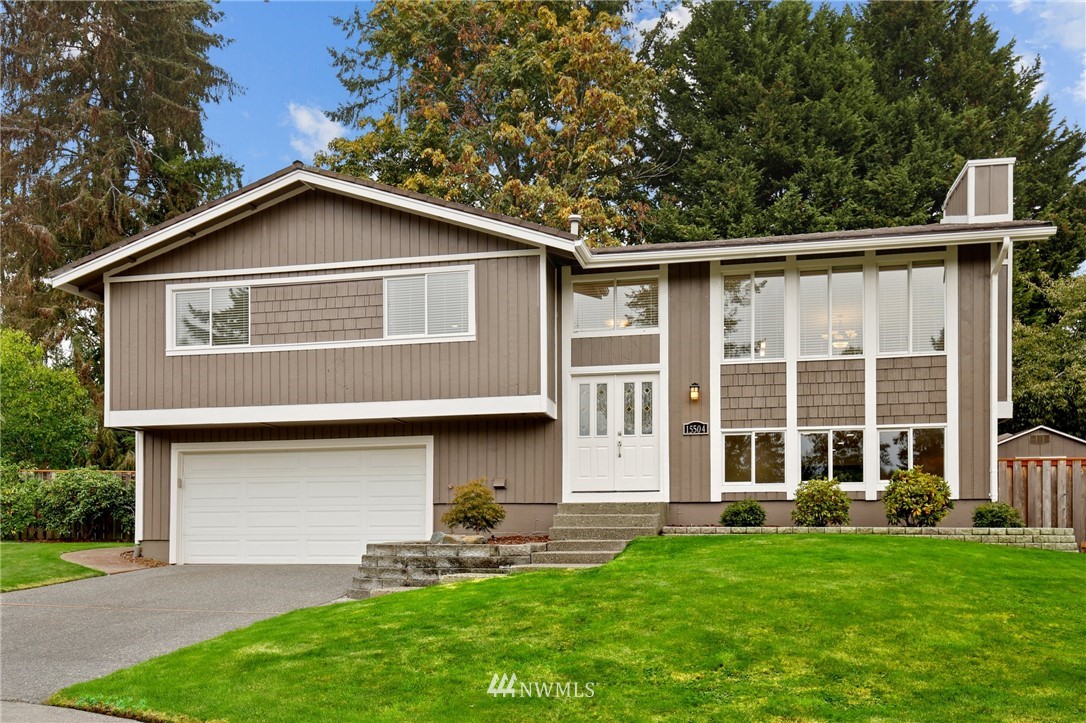 15504 Southeast 178th Place Renton, WA 98058 - Photo 1 of 40 a front view of a house with a yard and porch