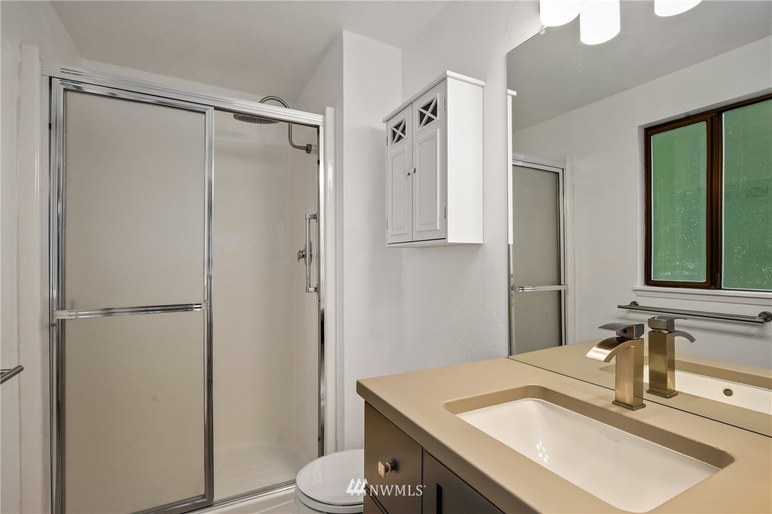 15504 Southeast 178th Place Renton, WA 98058 - Photo 19 of 40 a bathroom with a sink and a mirror