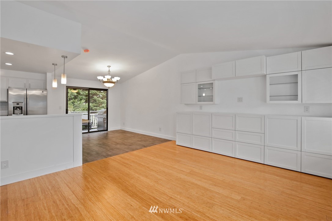 15504 Southeast 178th Place Renton, WA 98058 - Photo 3 of 40 a view of an empty room with wooden floor