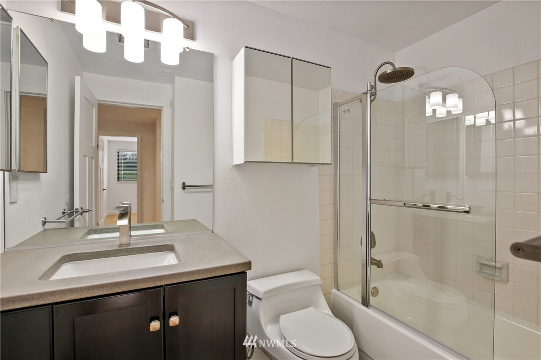 15504 Southeast 178th Place Renton, WA 98058 - Photo 23 of 40 a bathroom with a sink a toilet and shower