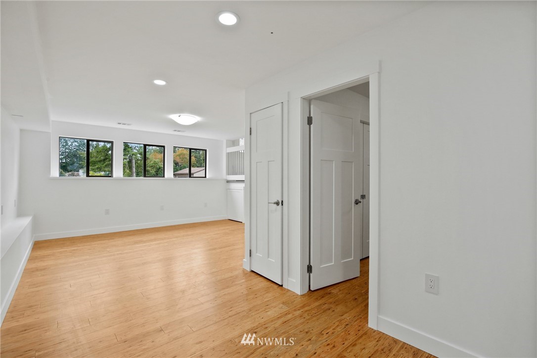 15504 Southeast 178th Place Renton, WA 98058 - Photo 27 of 40 a view of an empty room with wooden floor and a window