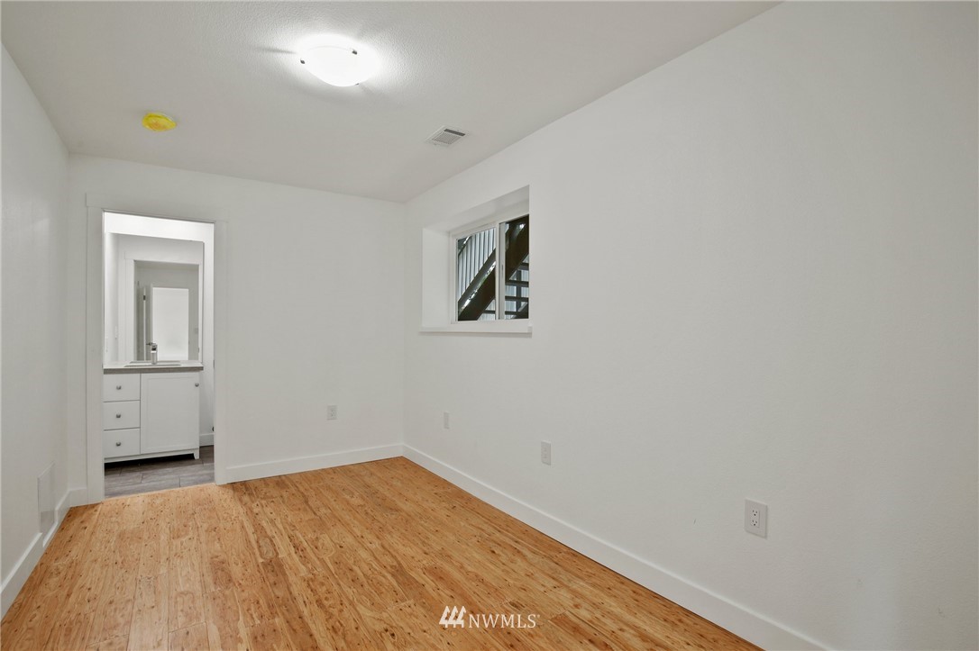 15504 Southeast 178th Place Renton, WA 98058 - Photo 29 of 40 a view of empty room with wooden floor