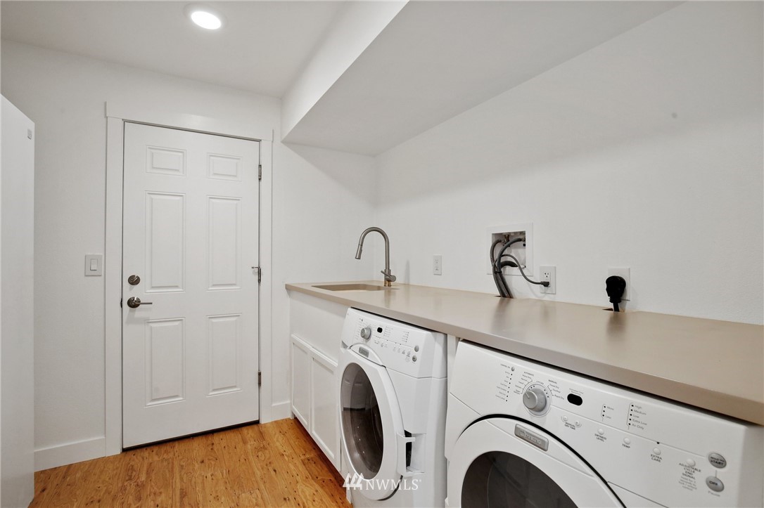 15504 Southeast 178th Place Renton, WA 98058 - Photo 32 of 40 a view of storage and utility room with washer and dryer