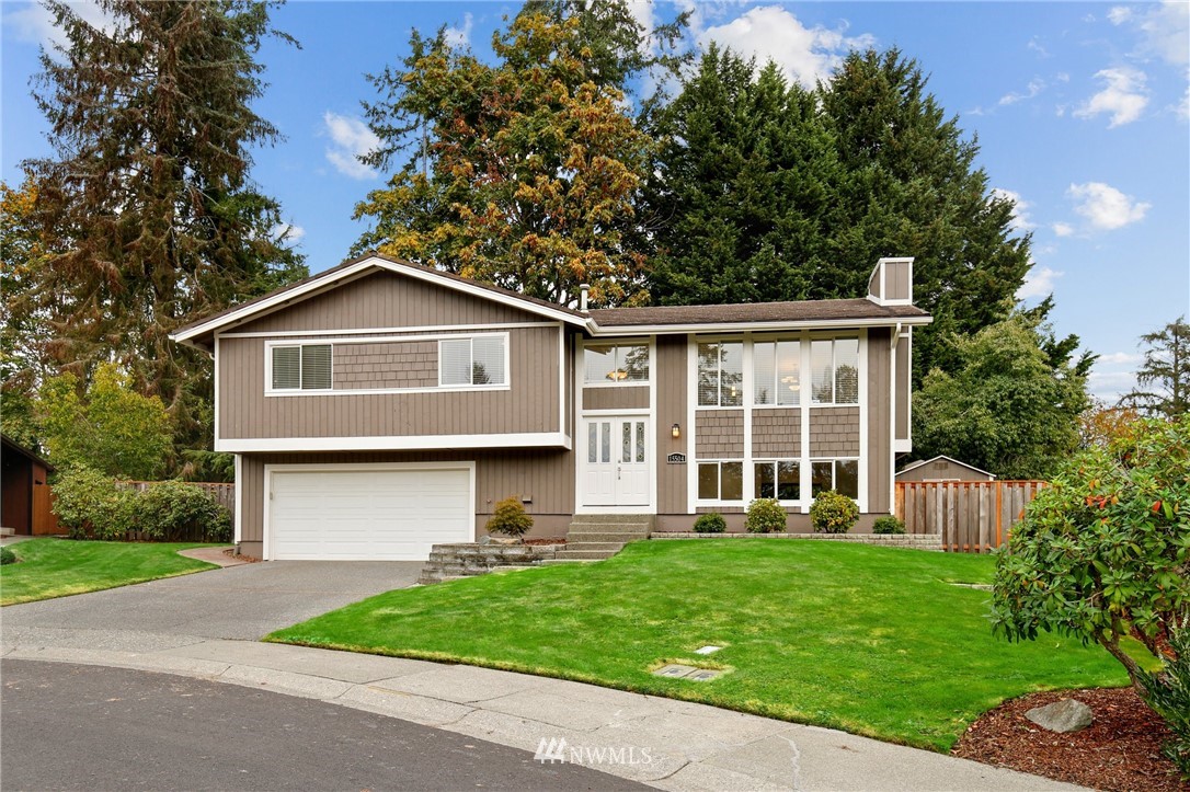 15504 Southeast 178th Place Renton, WA 98058 - Photo 40 of 40 a front view of a house with a yard and trees