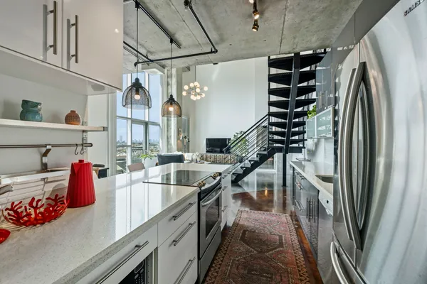 a kitchen that has a lot of cabinets in it