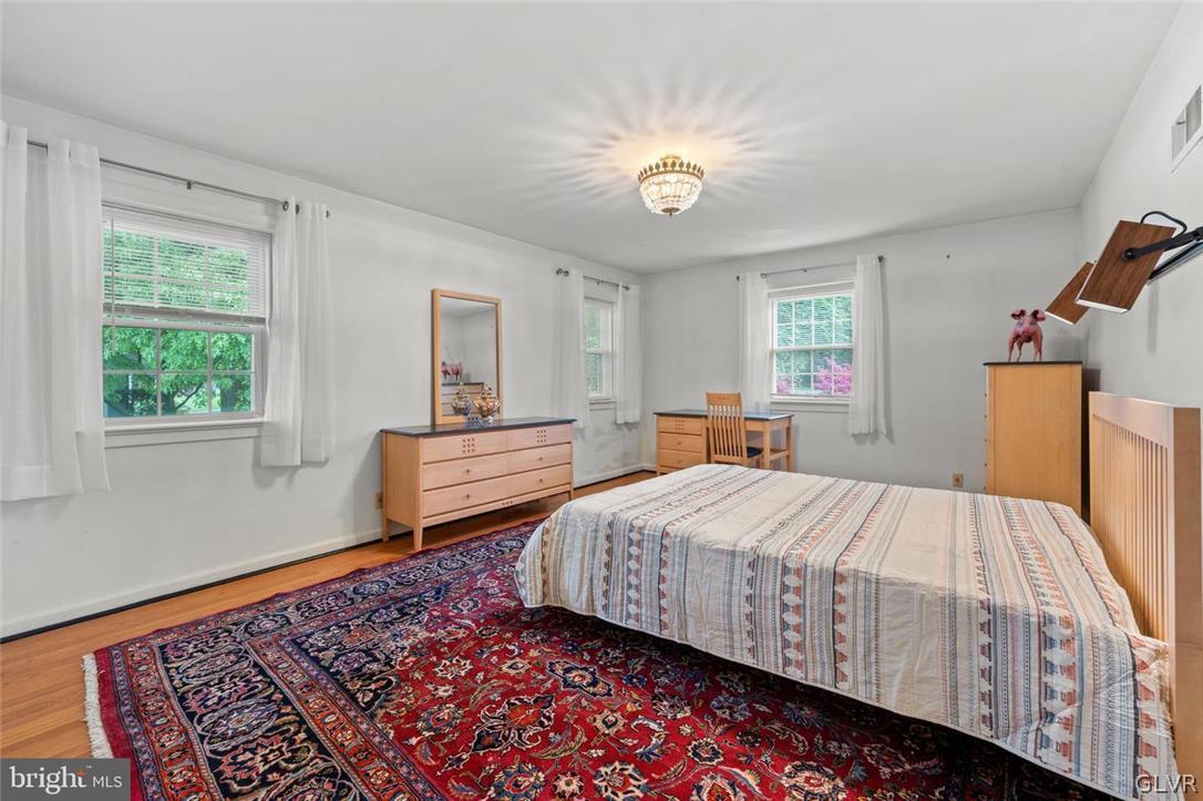 5081 Oley Turnpike Road Reading, PA 19606 - Photo 15 of 44 a bedroom with a bed and wooden floor