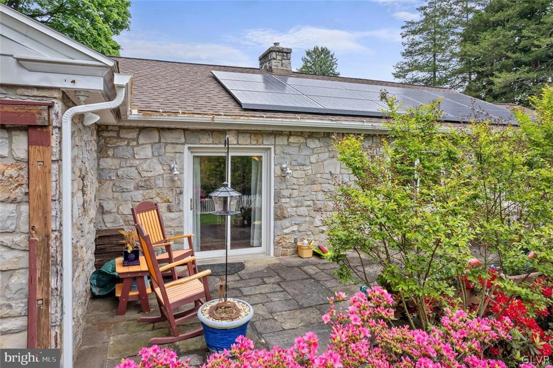 5081 Oley Turnpike Road Reading, PA 19606 - Photo 36 of 44 a view of a patio with table and chairs and potted plants
