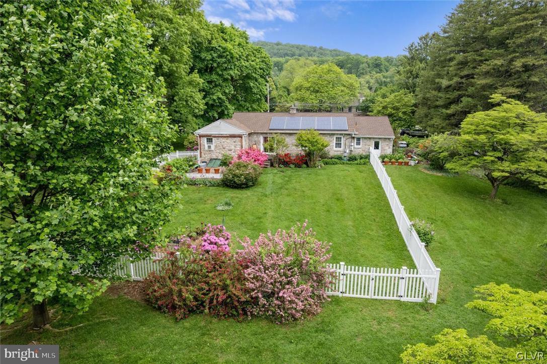 5081 Oley Turnpike Road Reading, PA 19606 - Photo 43 of 44 a view of a house with a yard and garden