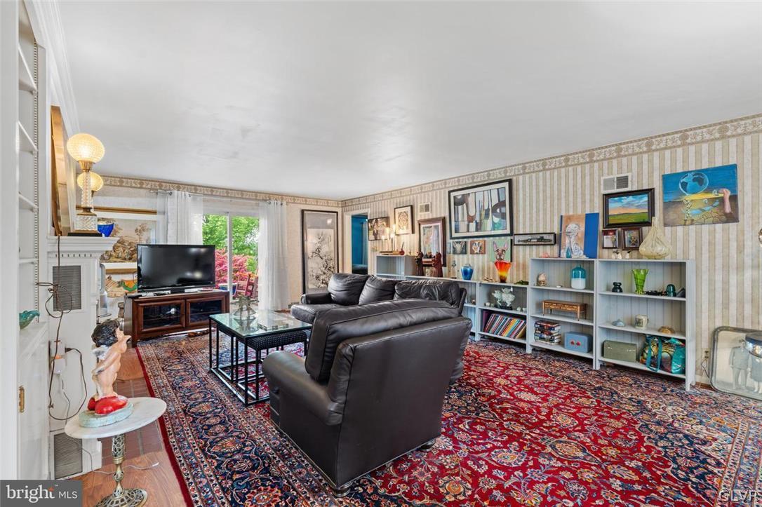 5081 Oley Turnpike Road Reading, PA 19606 - Photo 7 of 44 a living room with furniture and a flat screen tv