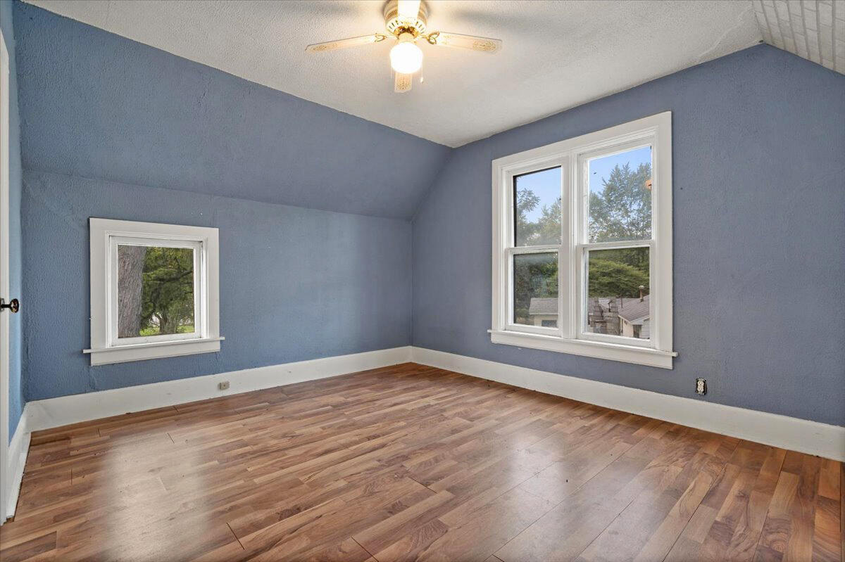 206 South Main Street Morocco, IN 47963 - Photo 18 of 26 a view of an empty room with wooden floor and a window