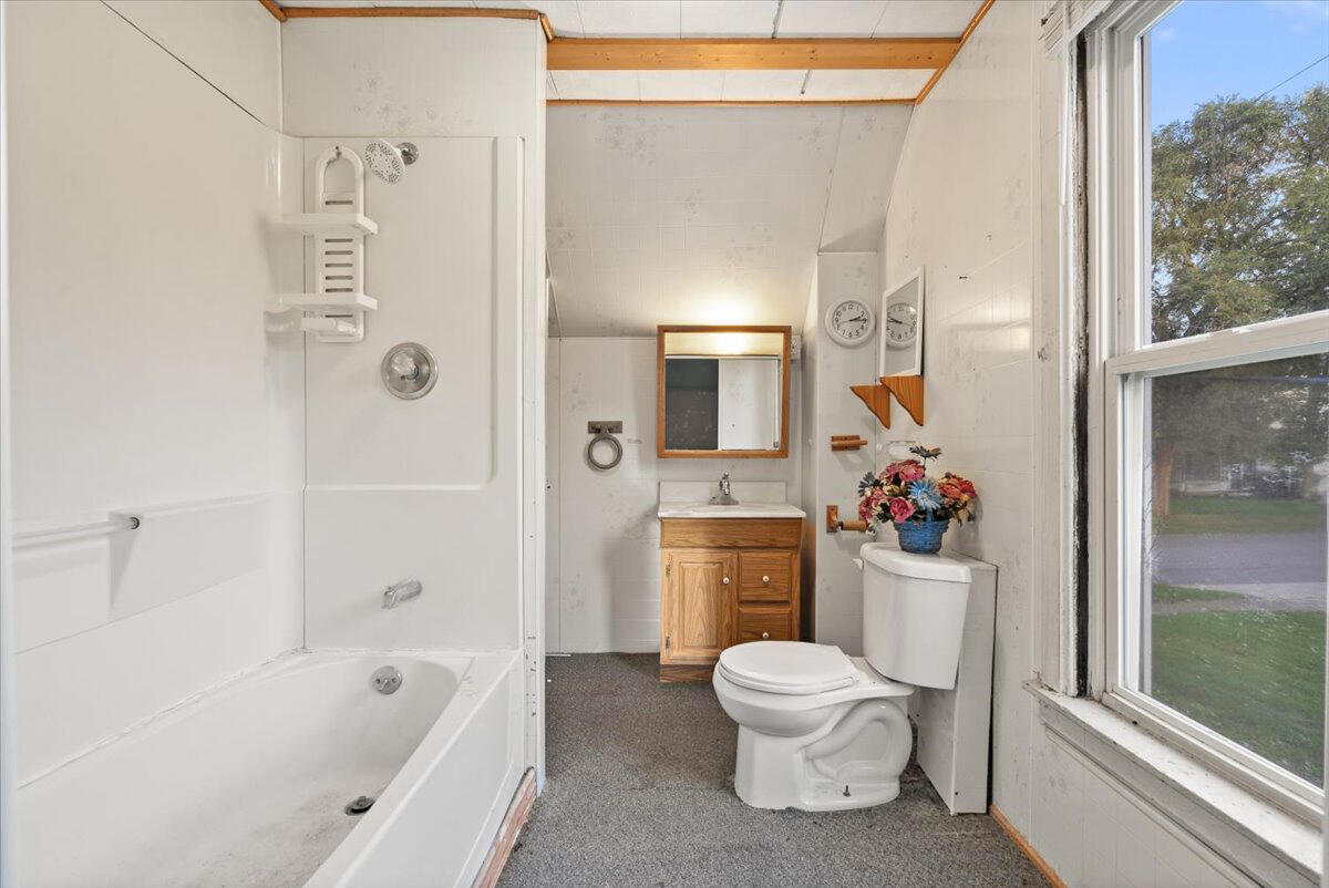 206 South Main Street Morocco, IN 47963 - Photo 22 of 26 a white toilet sitting next to a bathroom sink