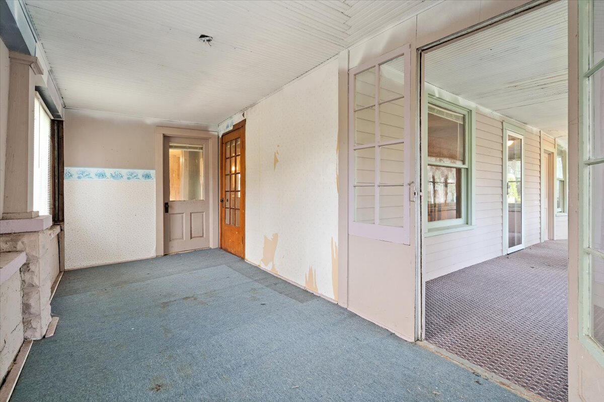 206 South Main Street Morocco, IN 47963 - Photo 4 of 26 an empty room with windows