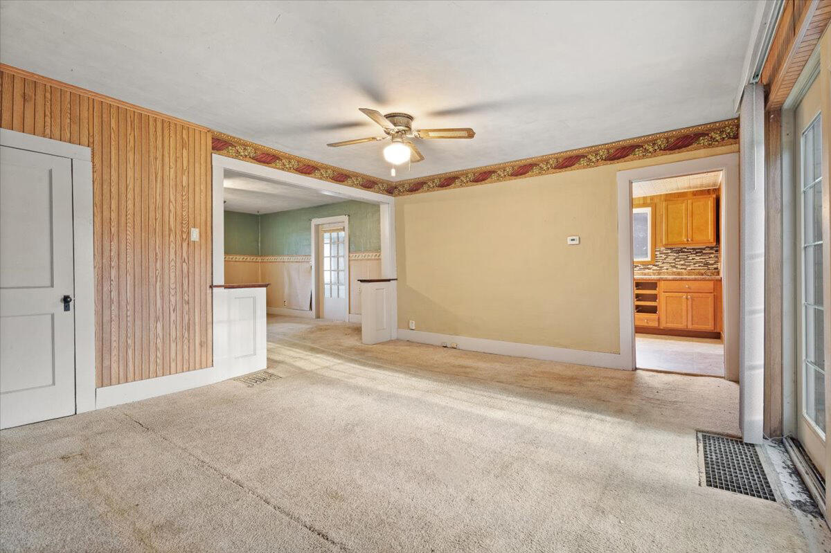 206 South Main Street Morocco, IN 47963 - Photo 9 of 26 a view of a livingroom with a chandelier fan and windows