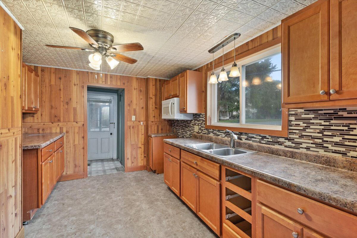 206 South Main Street Morocco, IN 47963 - Photo 10 of 26 a kitchen with stainless steel appliances granite countertop a sink stove and refrigerator