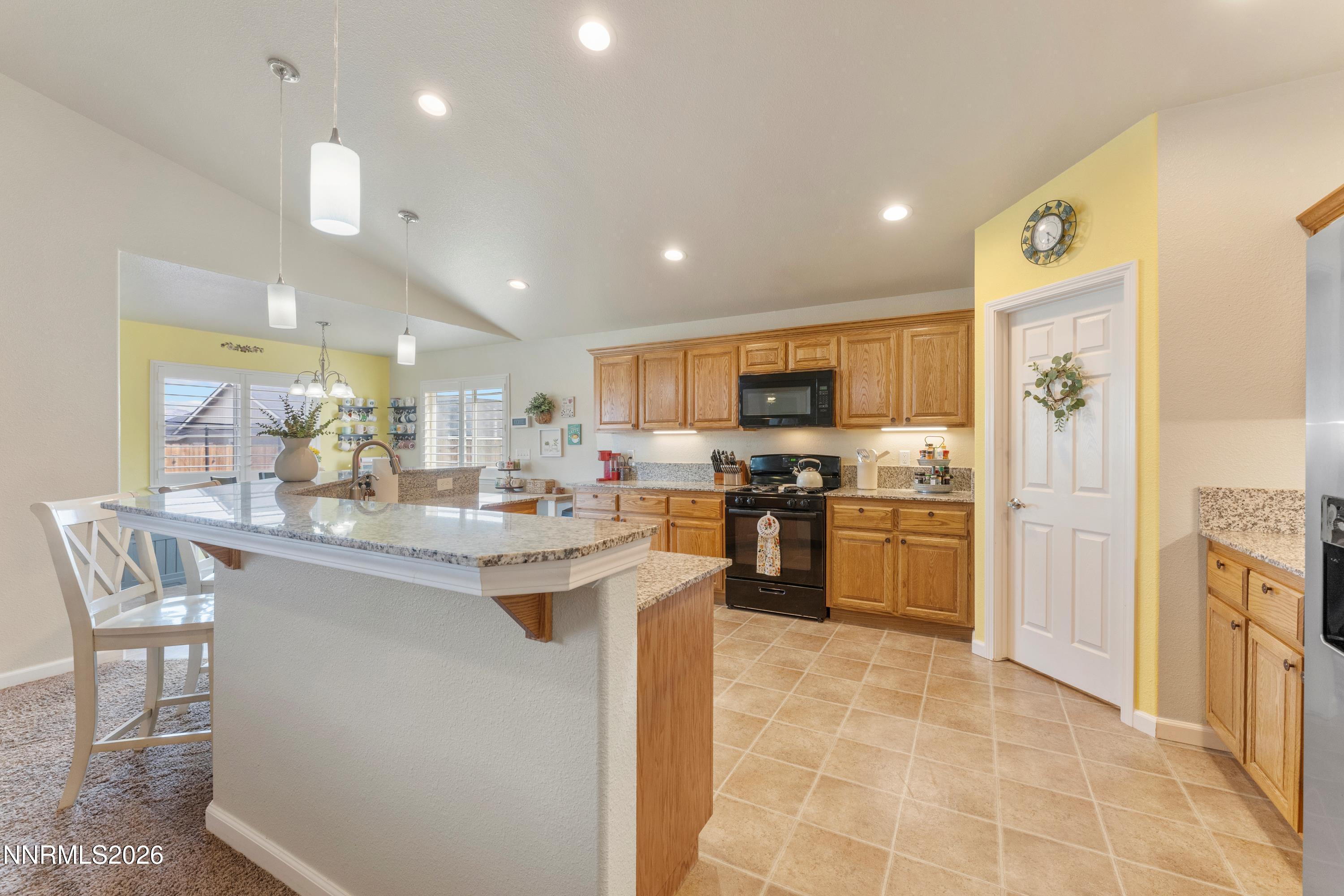 4540 Rutledge Street Fernley, NV 89408 - Photo 3 of 16 a kitchen with refrigerator and cabinets