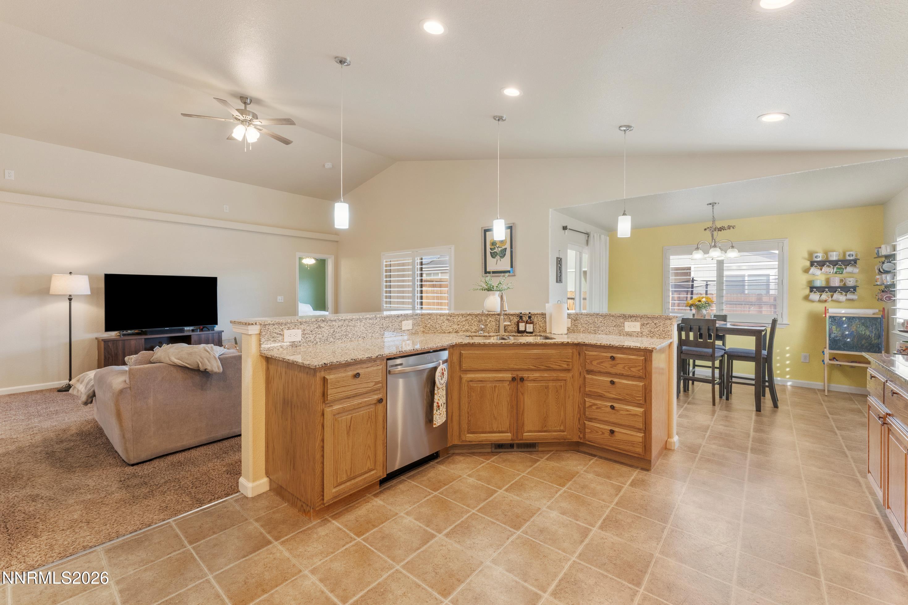 4540 Rutledge Street Fernley, NV 89408 - Photo 5 of 16 a large kitchen with a large counter top space appliances and cabinets