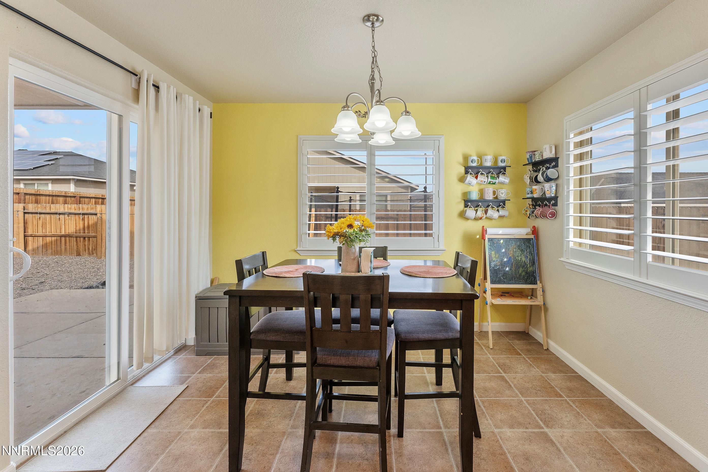 4540 Rutledge Street Fernley, NV 89408 - Photo 8 of 16 a view of a dining room with furniture and window
