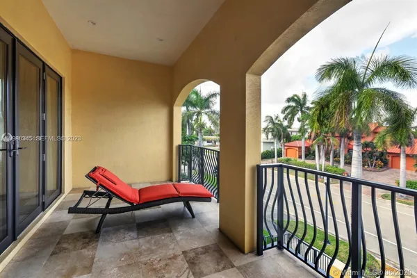a view of balcony with furniture