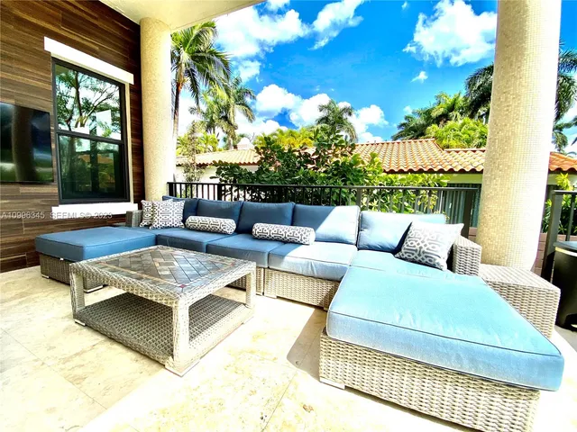 a outdoor living space with furniture and a potted plant