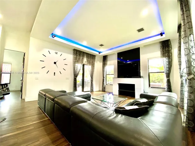 a kitchen with a table chairs and a fireplace