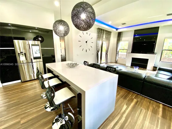 a kitchen with a table chairs and a fireplace