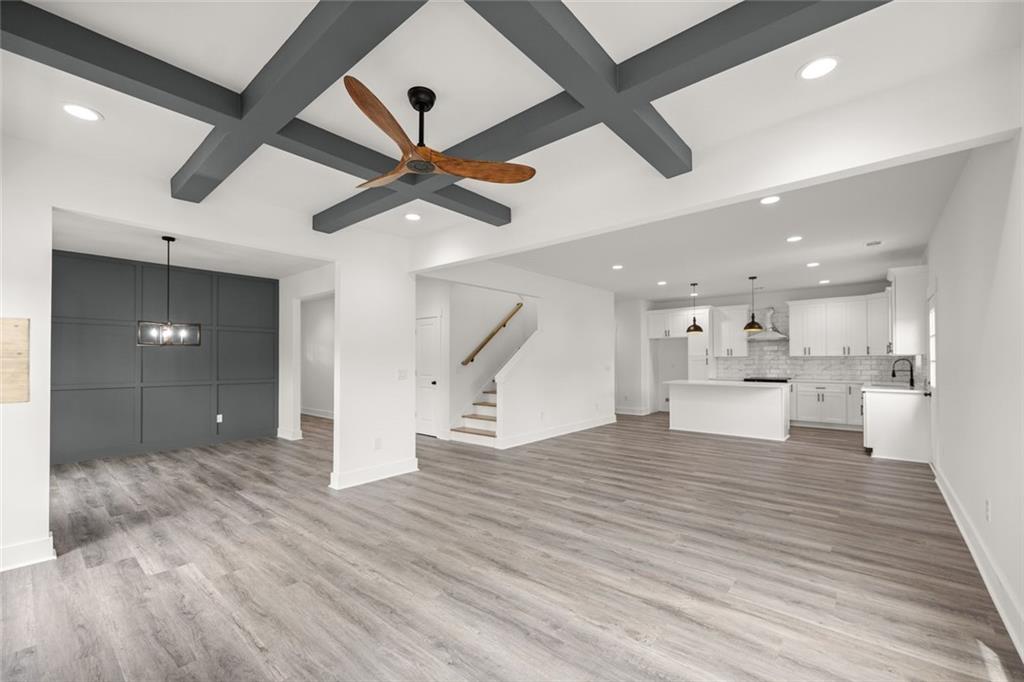 182 Hardman Road Clarkesville, GA 30523 - Photo 16 of 62 a view of empty room with wooden floor and ceiling fan