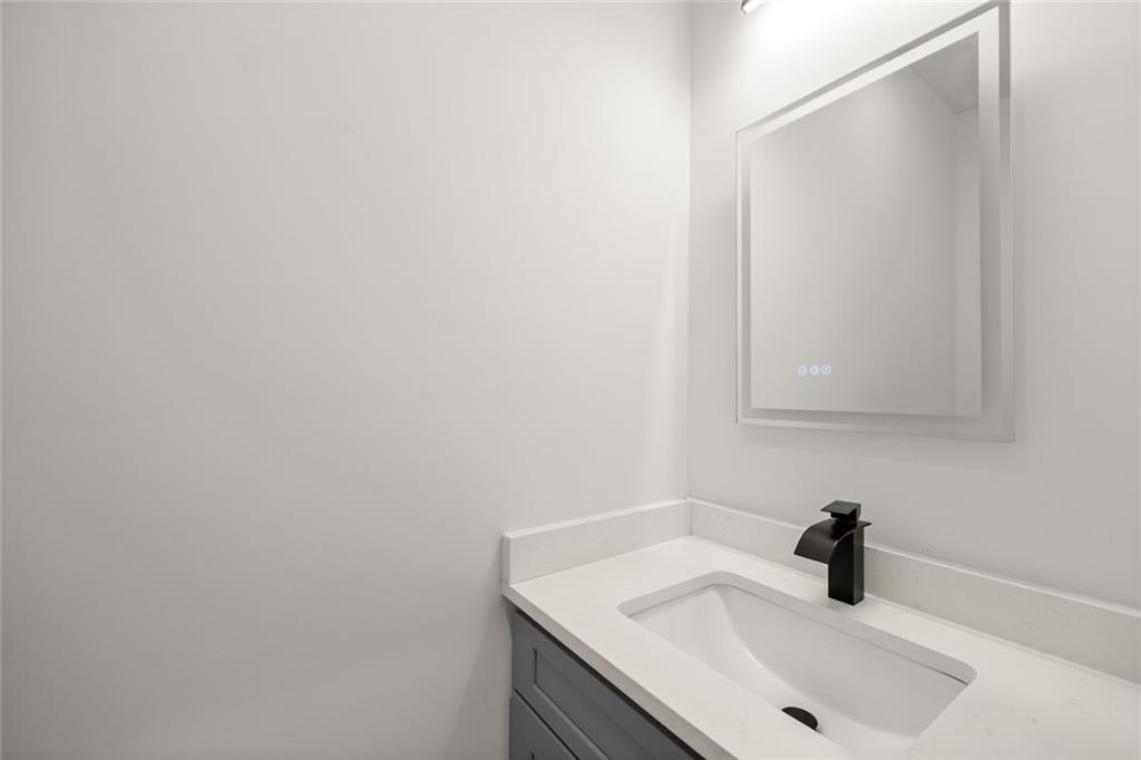 182 Hardman Road Clarkesville, GA 30523 - Photo 23 of 62 a bathroom with a sink and mirror