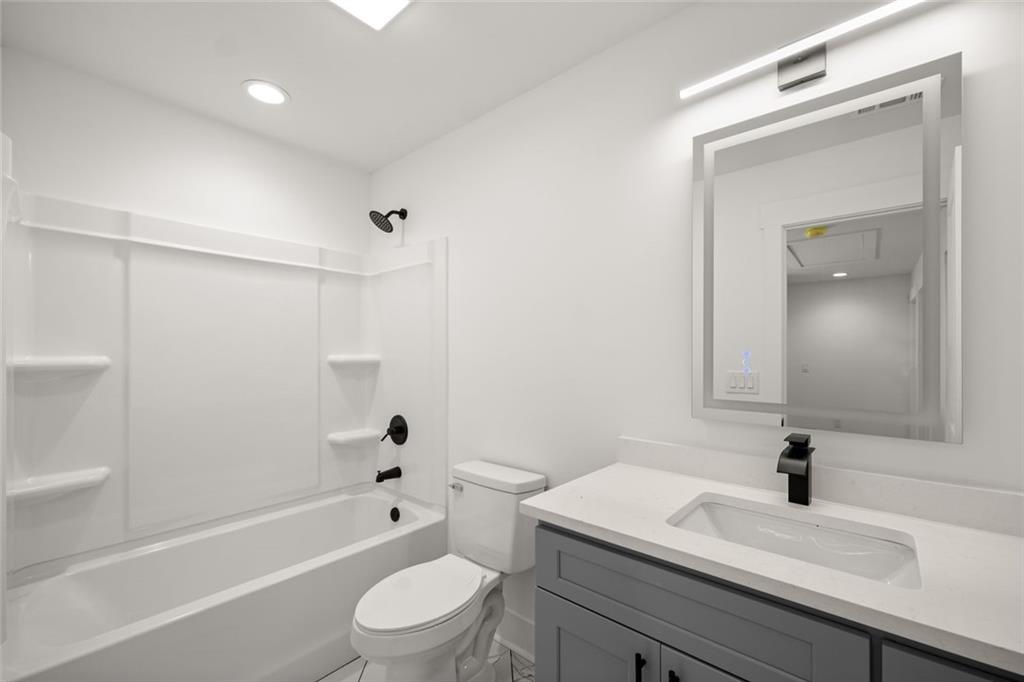 182 Hardman Road Clarkesville, GA 30523 - Photo 26 of 62 a bathroom with a sink a toilet and shower