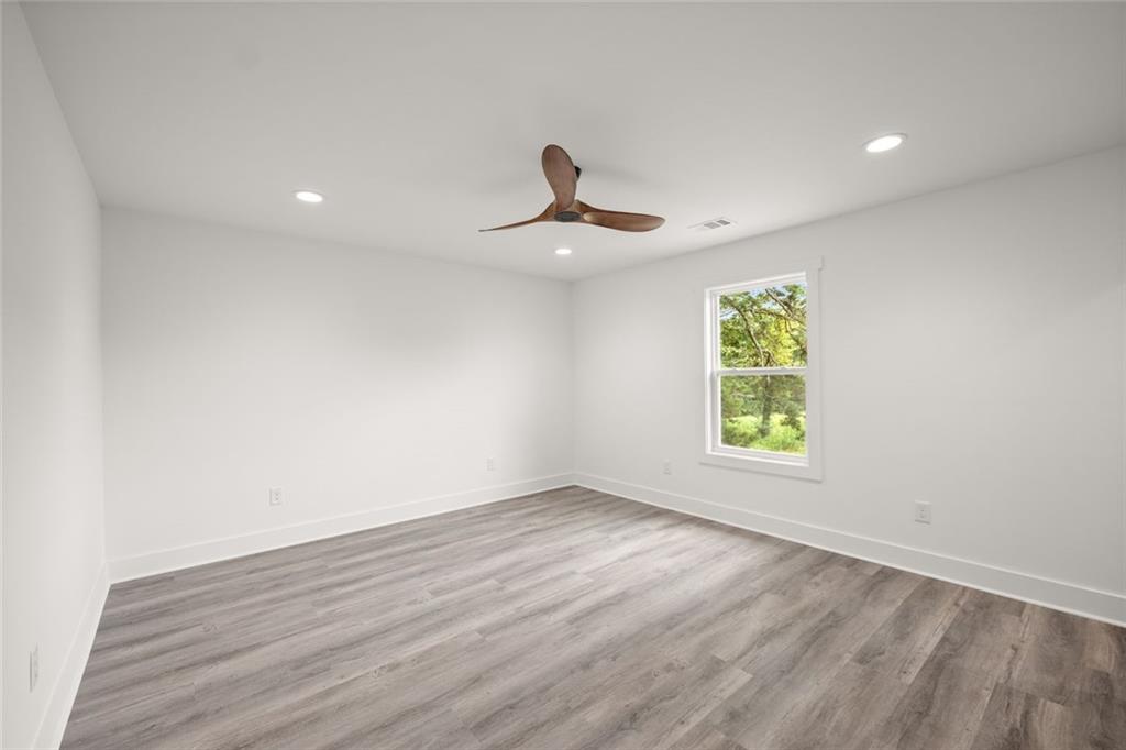 182 Hardman Road Clarkesville, GA 30523 - Photo 28 of 62 wooden floor in an empty room with a window